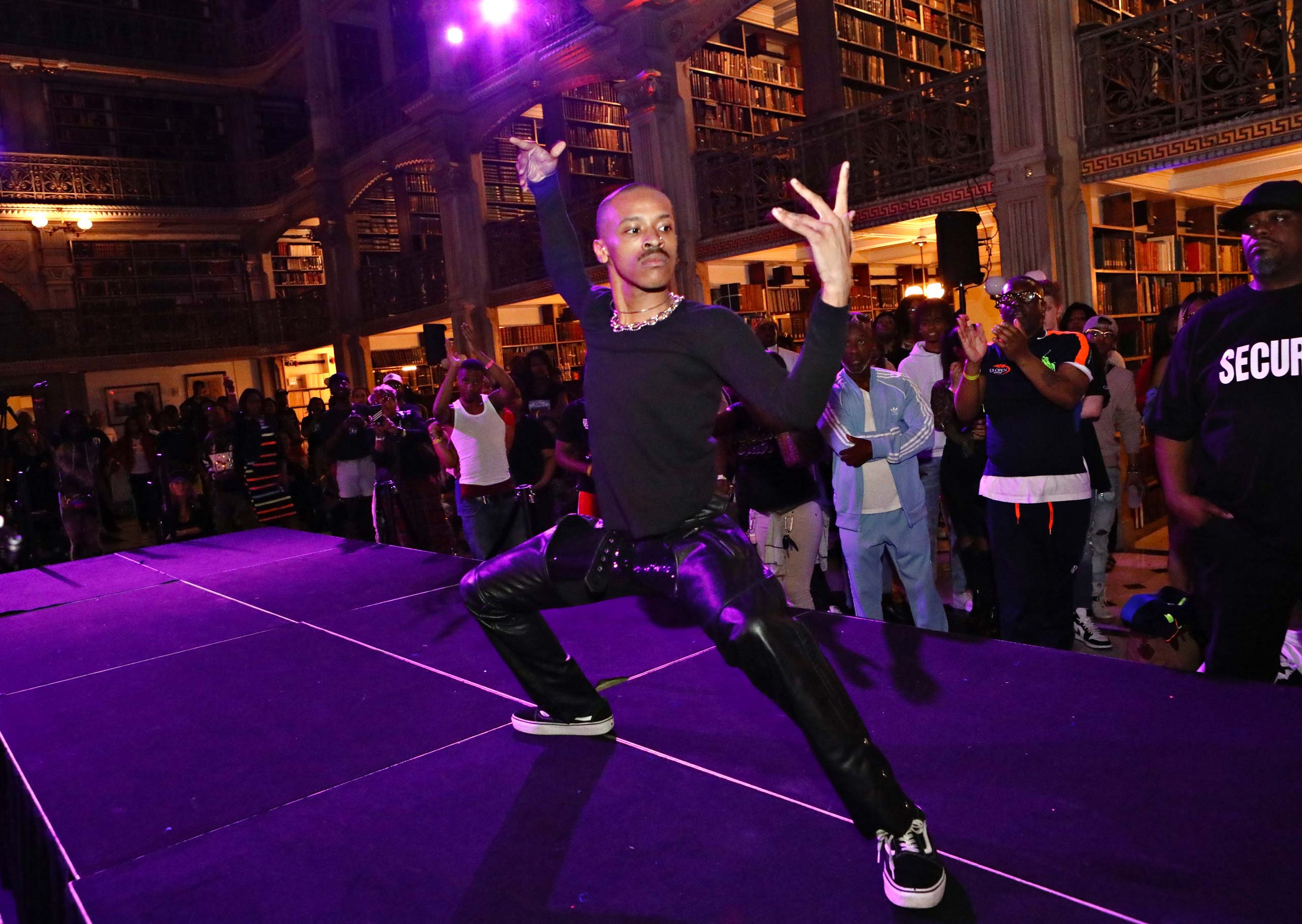 A performer on the stage at the George Peabody Library