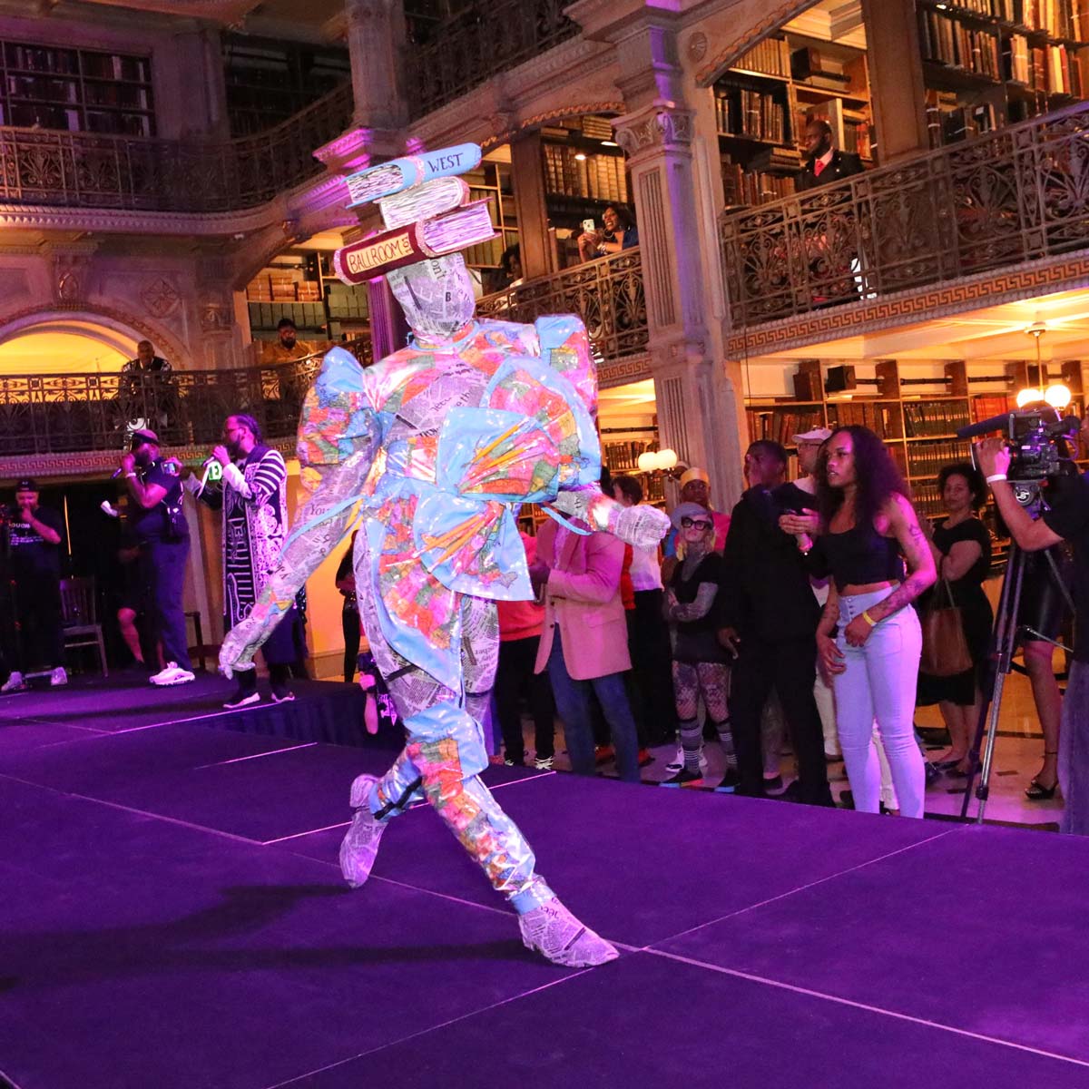 A performer on the stage at the George Peabody Library
