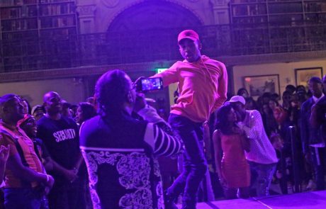 A performer on the stage at the George Peabody Library