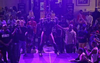 A performer on the stage at the George Peabody Library