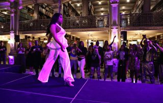 A performer on the stage at the George Peabody Library