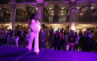 A performer on the stage at the George Peabody Library