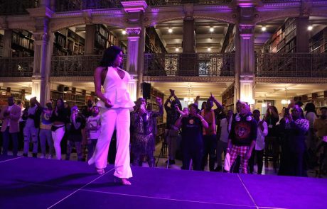 A performer on the stage at the George Peabody Library