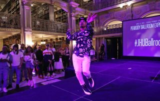 A performer on the stage at the George Peabody Library
