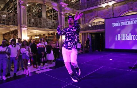 A performer on the stage at the George Peabody Library