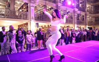 A performer on the stage at the George Peabody Library