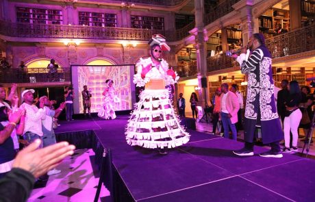 A performer on the stage at the George Peabody Library