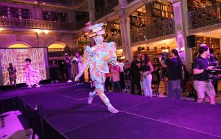 A performer on the stage at the George Peabody Library