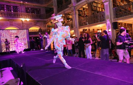 A performer on the stage at the George Peabody Library