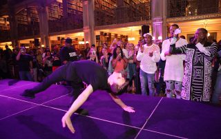 A performer on the stage at the George Peabody Library