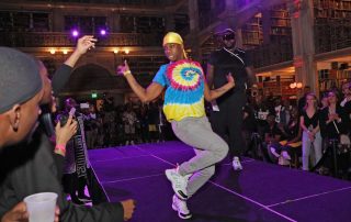 A performer on the stage at the George Peabody Library