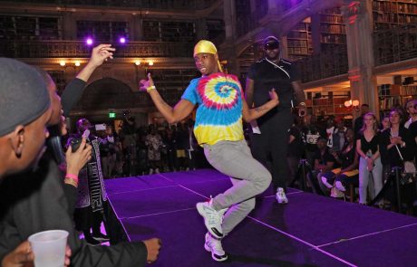 A performer on the stage at the George Peabody Library