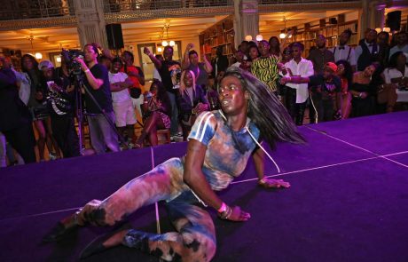A performer on the stage at the George Peabody Library