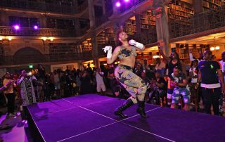 A performer on the stage at the George Peabody Library