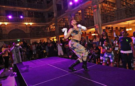 A performer on the stage at the George Peabody Library