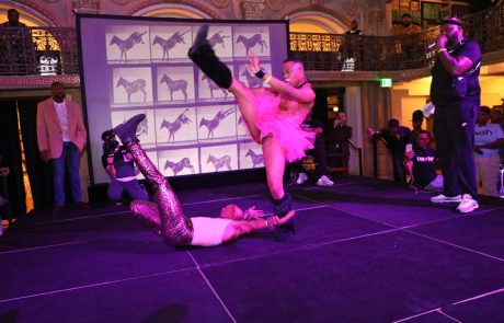 Two performers compete on the stage at the George Peabody Library