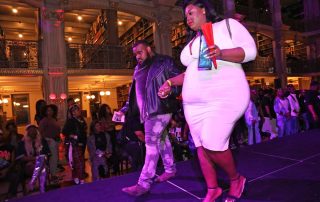 Two performers compete on the stage at the George Peabody Library