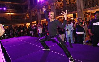 A performer on the stage at the George Peabody Library