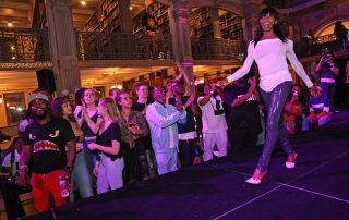 A performer on the stage at the George Peabody Library