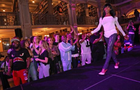 A performer on the stage at the George Peabody Library