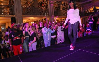 A performer on the stage at the George Peabody Library
