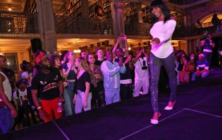 A performer on the stage at the George Peabody Library