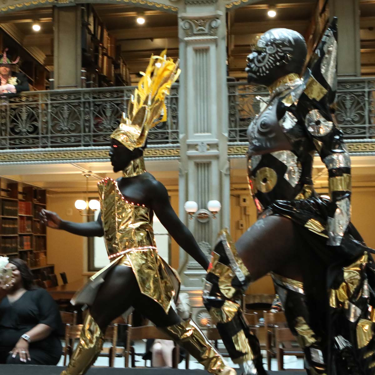 Two performers compete on the stage at the George Peabody Library