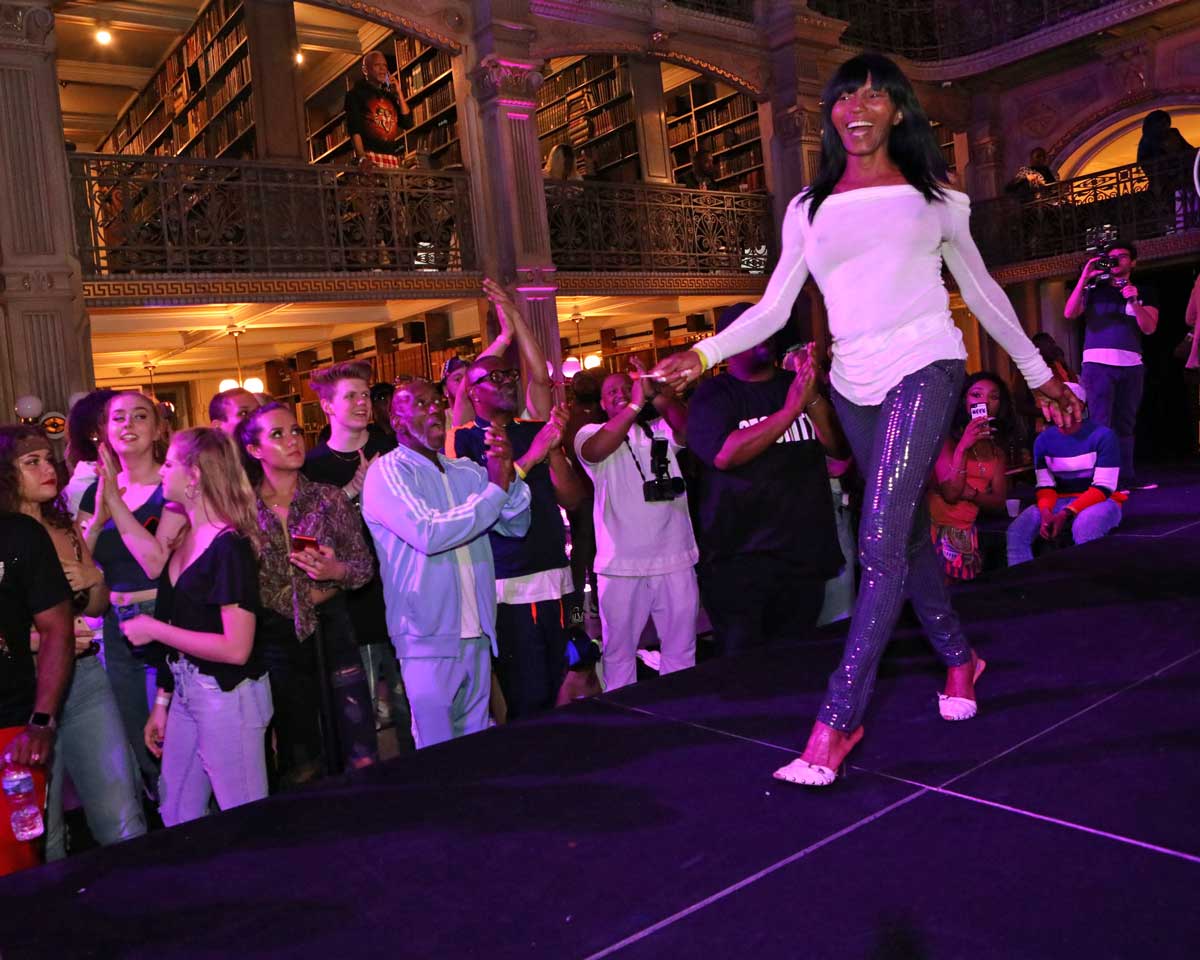 A performer on the stage at the George Peabody Library