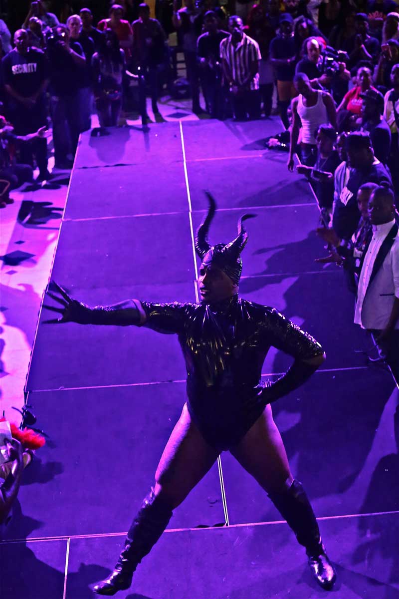 a performer in horns on the stage