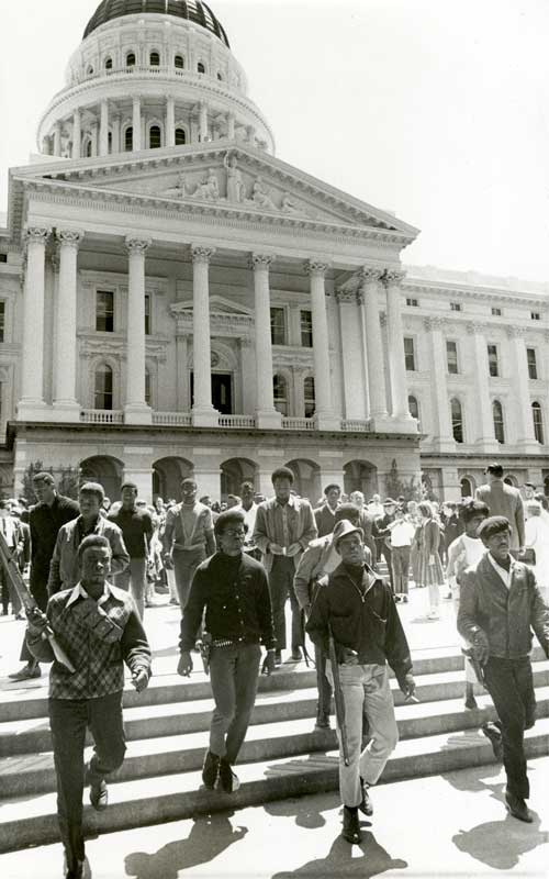 A group of people in front of a capital building