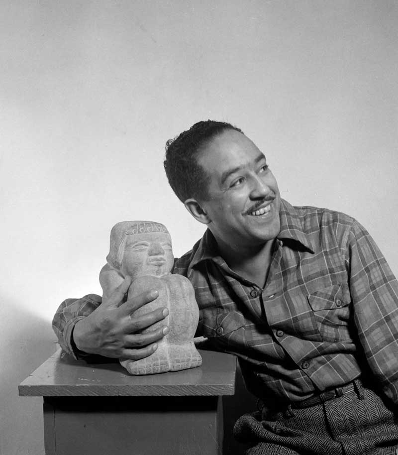 A person holds a statue