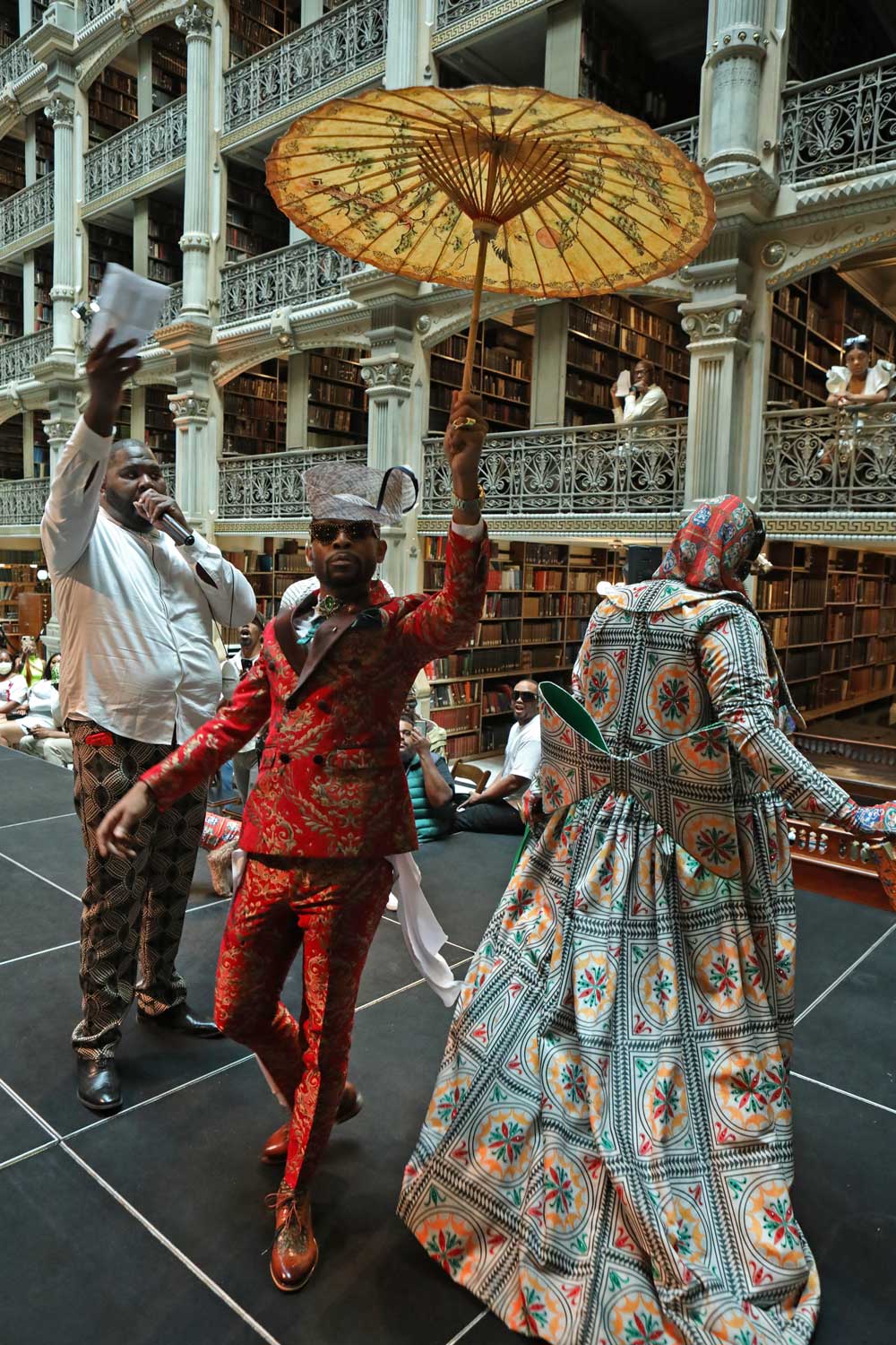 Two performers compete on the stage at the George Peabody Library