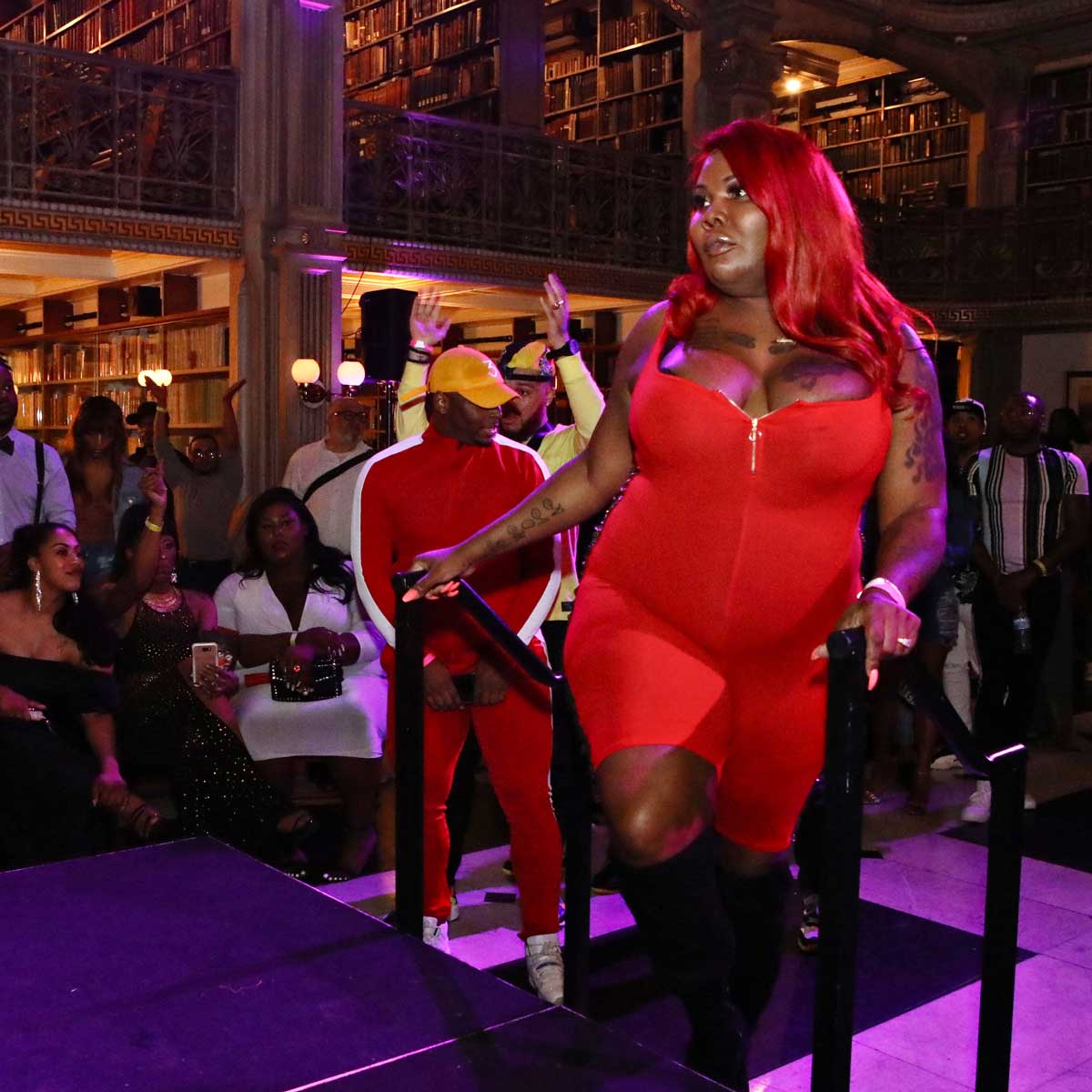 monique-west-2019 Performer in red bodysuit prepares to take the stage